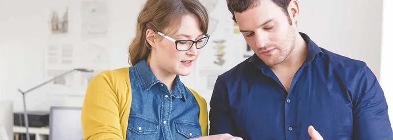 office workers looking at tablet